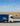 Тент грузовика с белым логотипом InterModal Logistic на фоне степи и летящего орла. Грузоперевозки по Казахстану и СНГ.